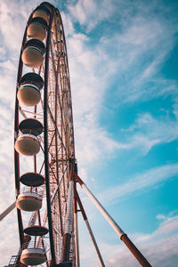 Low angle view of ferris wheel against sky