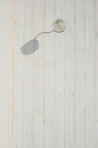 Electric light on wooden wall