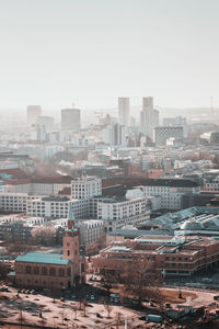 High angle view of buildings in city against clear sky