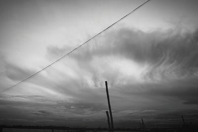 Low angle view of cables against sky