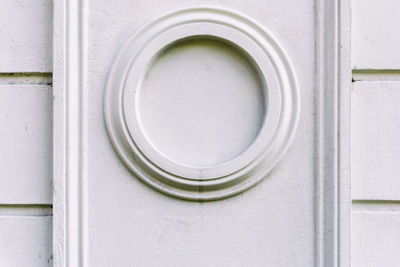 Close-up of circle shape on white wall