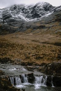 Scenic view of stream flowing through rocks