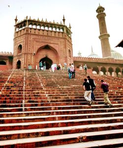 Low angle view of people on steps