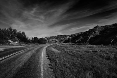 Road amidst landscape against sky