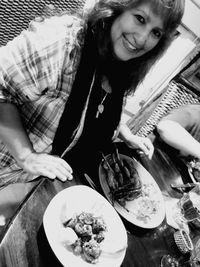 High angle view of woman having food in plate