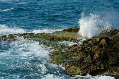 Waves splashing on rocks