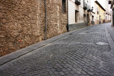 Cobblestone walkway by old houses