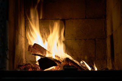 Close-up of fire burning at night