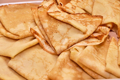 Blini russian crepes served folded on a dish