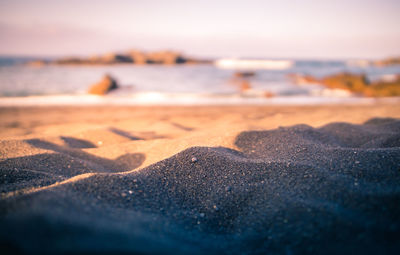 Surface level of beach against sky