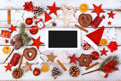 High angle view of tablet computer christmas decoration on table