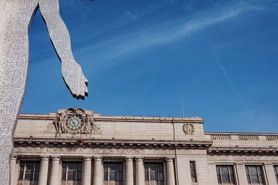 Low angle view of building against blue sky