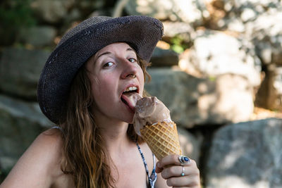 Portrait of young woman holding ice cream