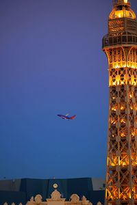 Low angle view of airplane flying in sky