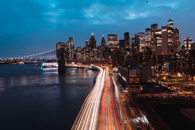 High angle view of illuminated bridge over river at night