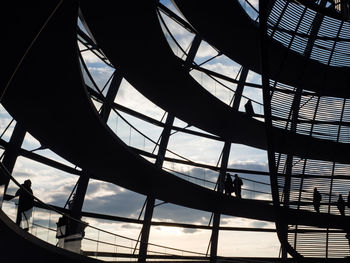 Low angle view of silhouette people on building