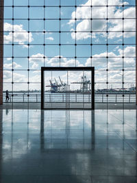 Reflection of building on glass window