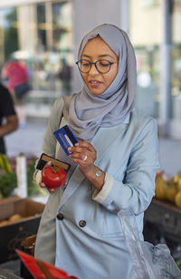 Woman wearing hijab doing shopping