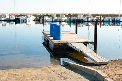 Boats moored at harbor