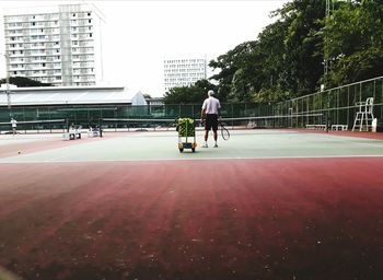 Man playing soccer in city