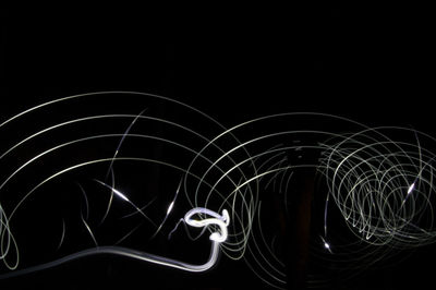 Light trails over black background