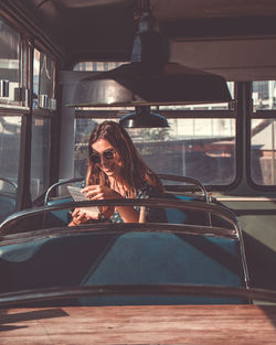 Woman sitting in bus