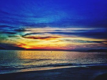 Scenic view of sea against dramatic sky