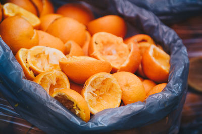 High angle view of orange fruits in basket