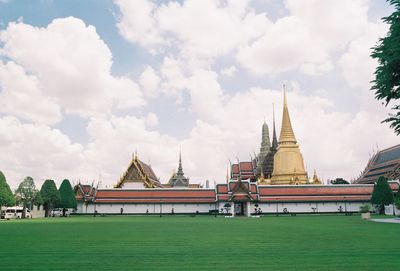 View of temple building against cloudy sky