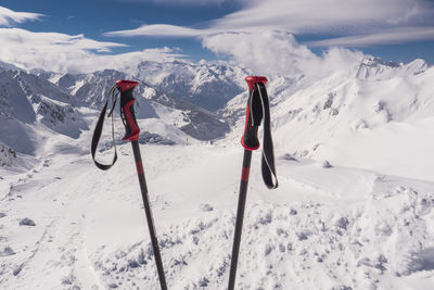 View of people skiing on snowcapped mountain