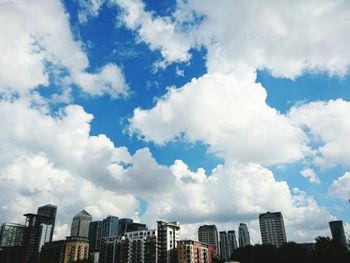 Low angle view of cityscape against sky