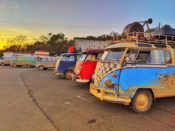 Cars on road against sky in city