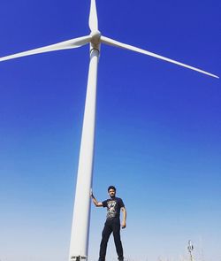 Low angle view of man standing against sky