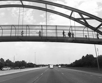 Bridge over road against sky