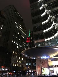 Low angle view of modern building at night