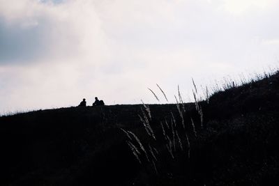 Silhouette man against sky