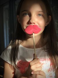 Portrait of cute girl holding ice cream