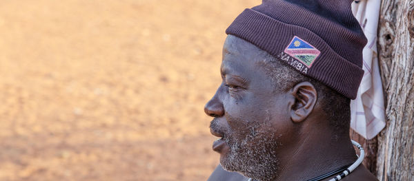 Close-up portrait of man looking away