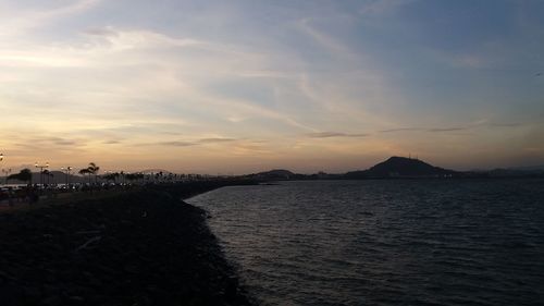 Scenic view of sea against sky at sunset