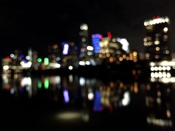 Defocused image of illuminated city at night