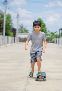 Full length of a man riding boy