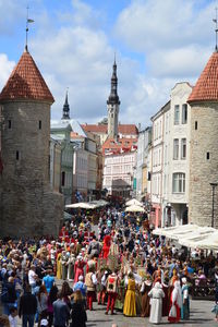 People at place of workshop against sky