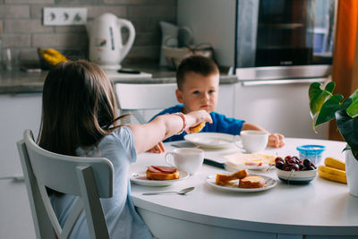 High angle view of people having food at home