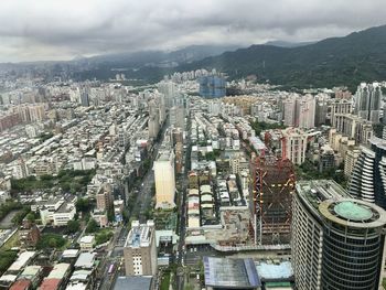 High angle view of buildings in city against sky