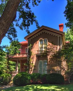 Low angle view of building against clear blue sky