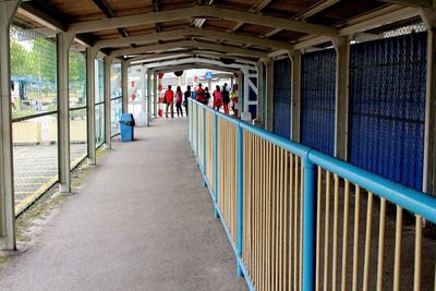 People in corridor of building