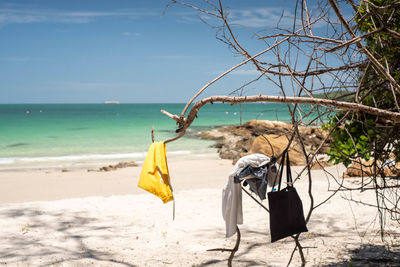 Umbrella on beach against sky