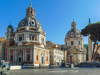 View of buildings in city against clear sky