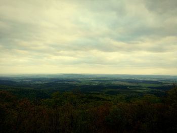 Scenic view of landscape against cloudy sky