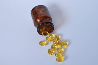Close-up of glass bottle against white background